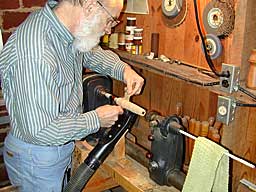 The author's lathe setup - notice the vacuum cleaner tube